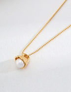 Dawn of the Pearl necklace featuring a natural pearl in 14k gold-plated sterling silver setting, symbolizing elegance and new beginnings.