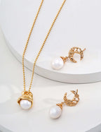 Dawn of the Pearl necklace and earrings set in 14k gold-plated sterling silver featuring natural pearls.