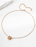 14k gold plated pendant barrel with cubic zirconia on delicate adjustable Mira Aura chain necklace