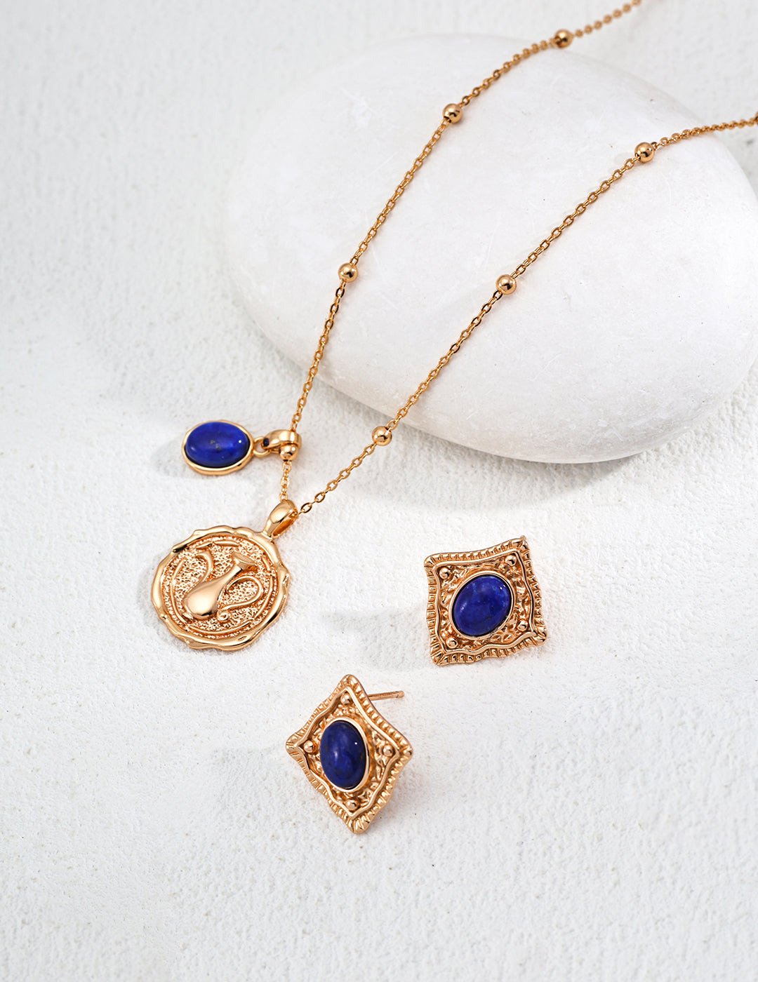 Mira Aura gold plated gemstone necklace with blue lapis coin pendant and matching diamond stud earrings