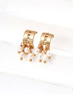 Mira Aura gold hoop earrings with dangling freshwater pearls and gold bead charms modern pearl earrings for women
