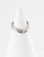 Gold plated adjustable ring for women with a sleek modern design displayed on a white ring holder