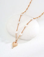 Mira Aura gold plated heart pendant necklace with textured heart charm small pearls and delicate chain