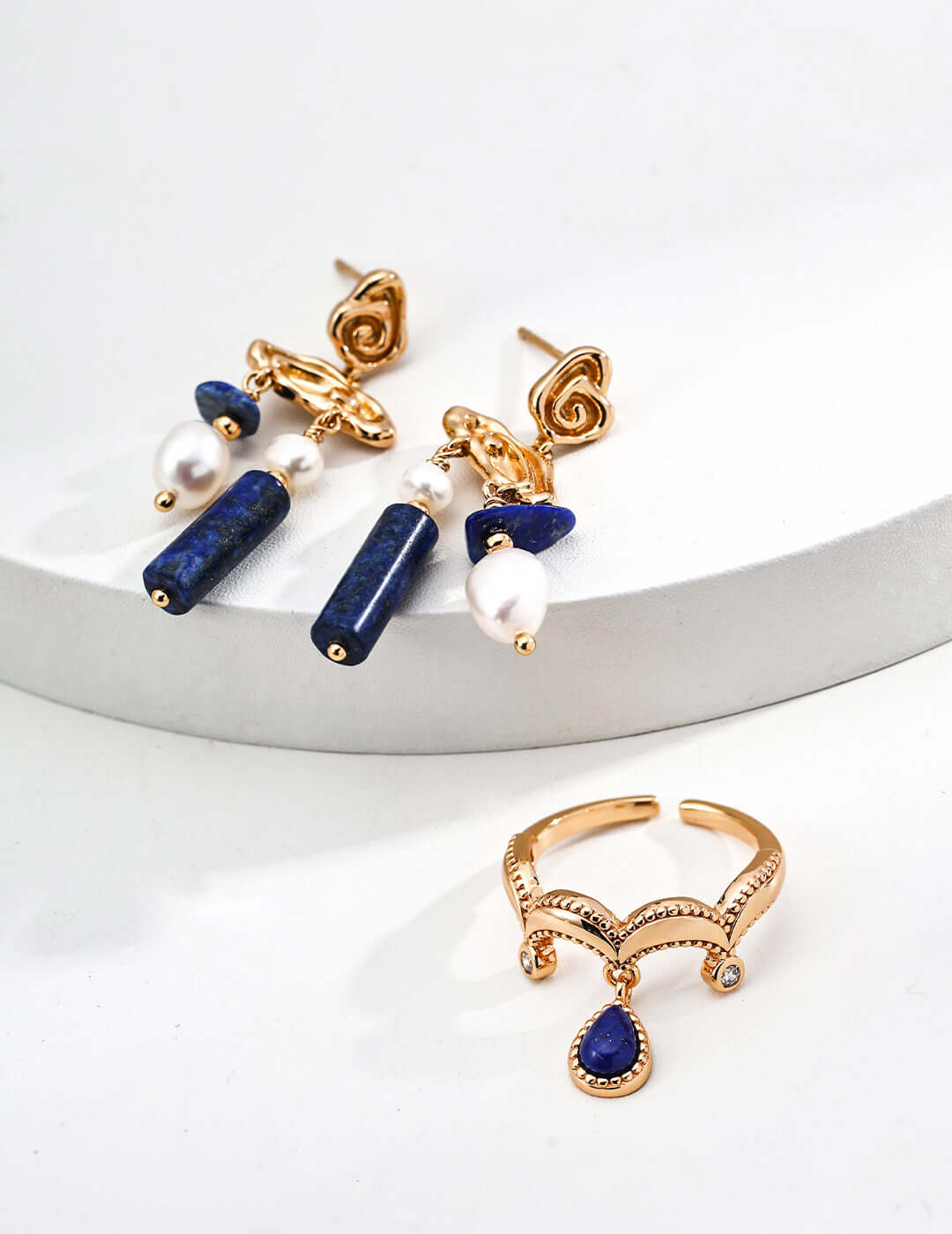 Mira Aura gold adjustable unique gemstone statement ring with blue teardrop stone and crystal accents