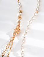 Mira Aura pacific pearl necklace close up of white freshwater pearls with gold floral clasp and chain