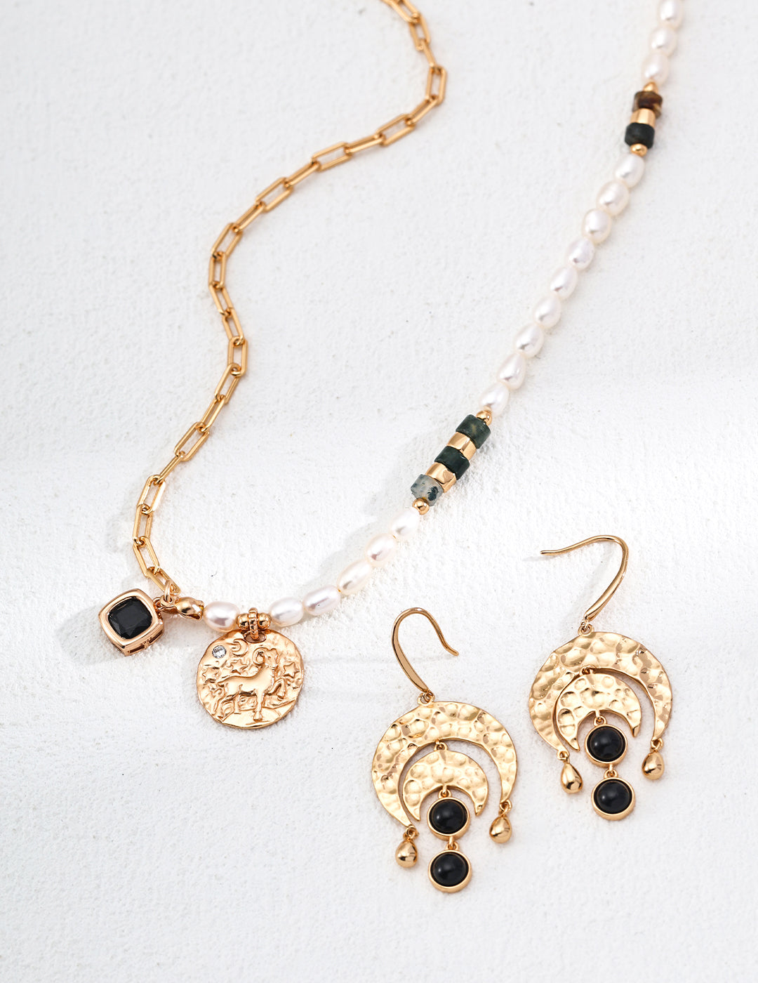 Mira Aura pearl and gemstone necklace for Aries with gold coin charm and matching black stone dangle earrings